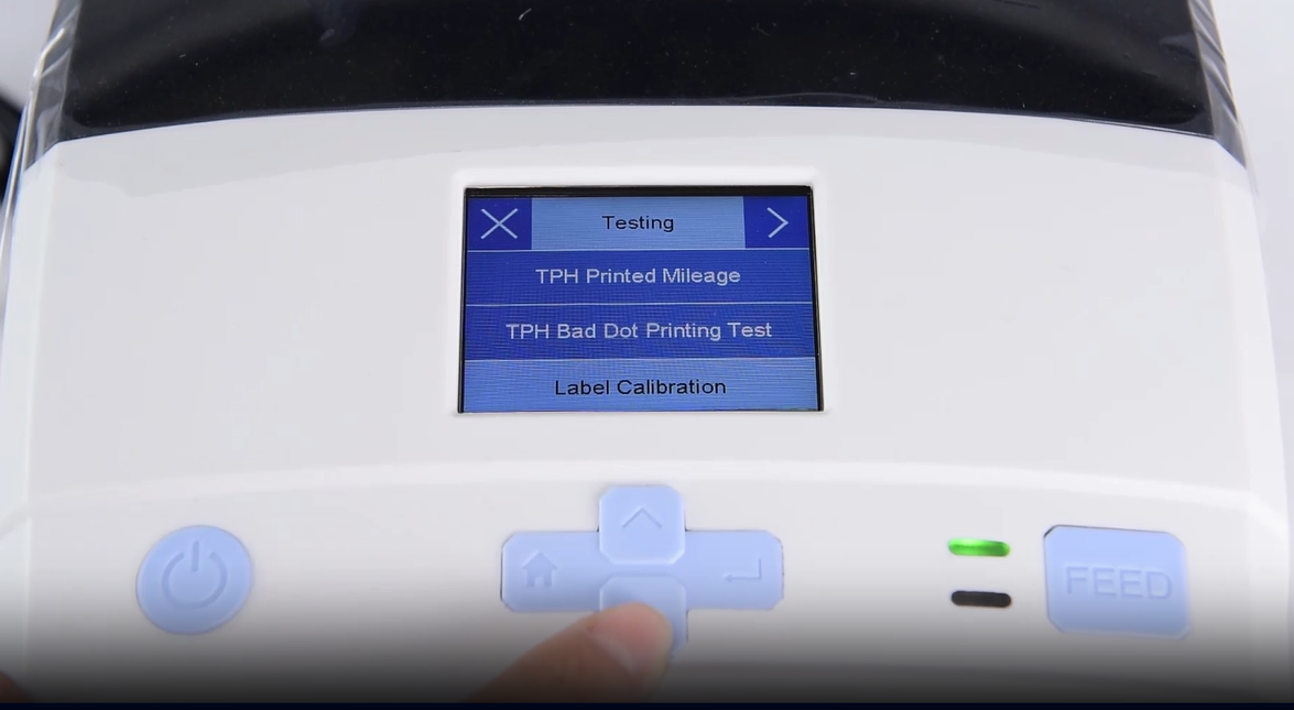 Üks close-up of a machine's digital interface showing a testing menu.